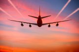 airplane-flying-in-the-sky-at-sunset-with-vapor-trails-istock_50476228_xlarge-2.jpg